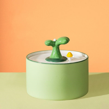 a small green object sitting on top of a table