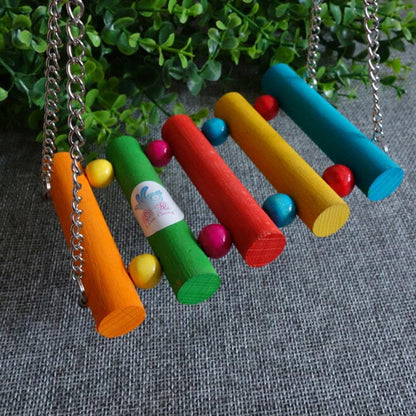 a bunch of toys that are hanging from a chain